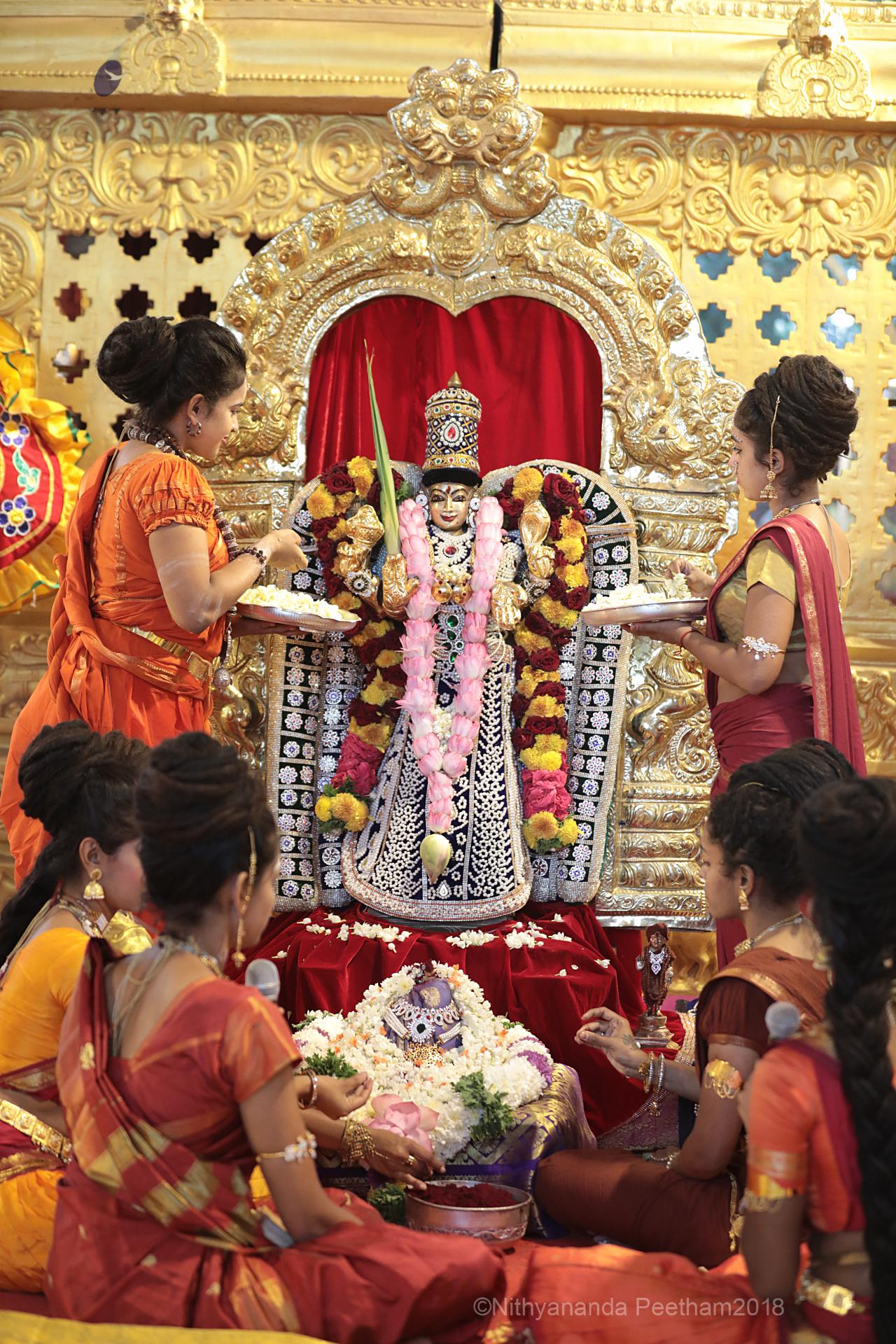 Bālasanyāsis performing pūjā and abhiṣeka