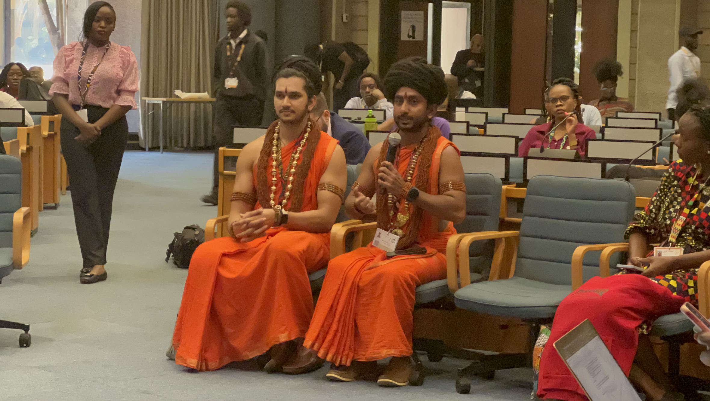 A bālasanyāsi addresses the floor at the UN Environment Programme